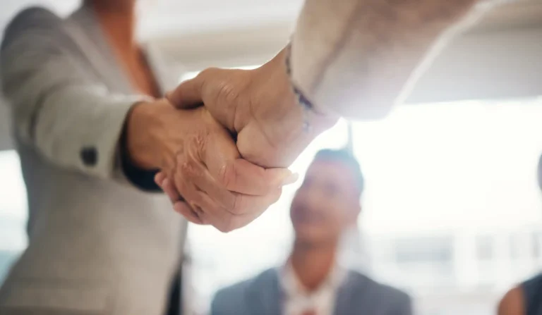 Handshake, hiring and contract with people in office